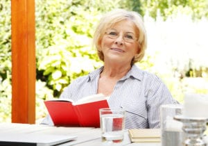 Older woman relaxing with a book
